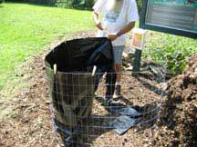 Fasten black sheeting to top of the compost bin with cloths pins.
